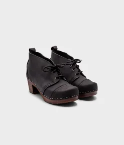 Chukka cap toe clog boots