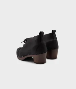 Chukka cap toe clog boots