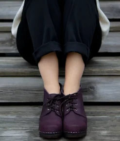 Chukka cap toe clog boots