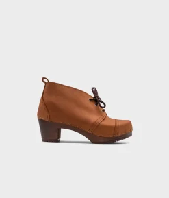 Chukka cap toe clog boots