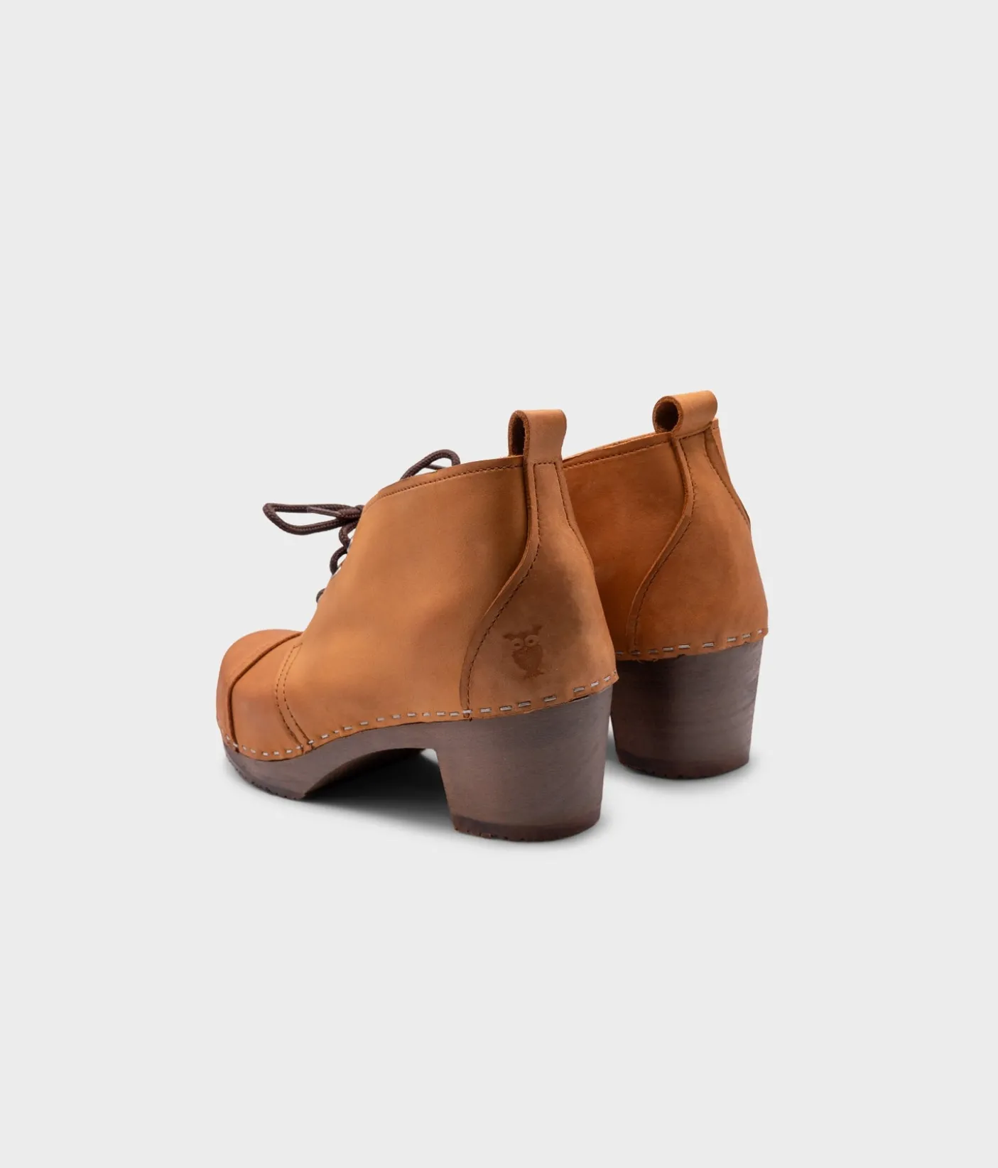 Chukka cap toe clog boots