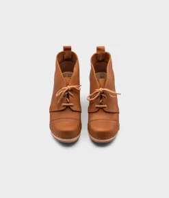 Chukka cap toe clog boots