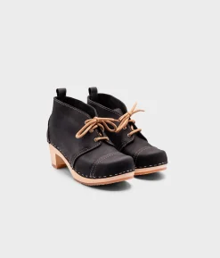 Chukka cap toe clog boots