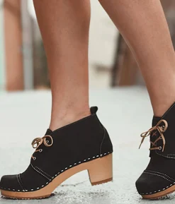 Chukka cap toe clog boots