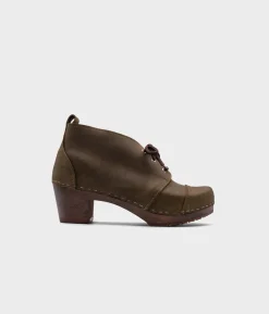 Chukka cap toe clog boots