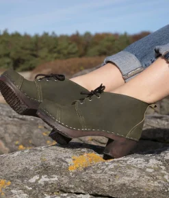 Chukka cap toe clog boots